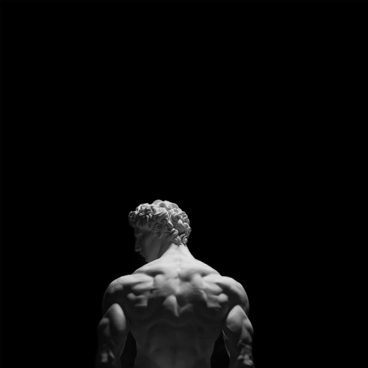 Statue of David by Michelangelo against a black background